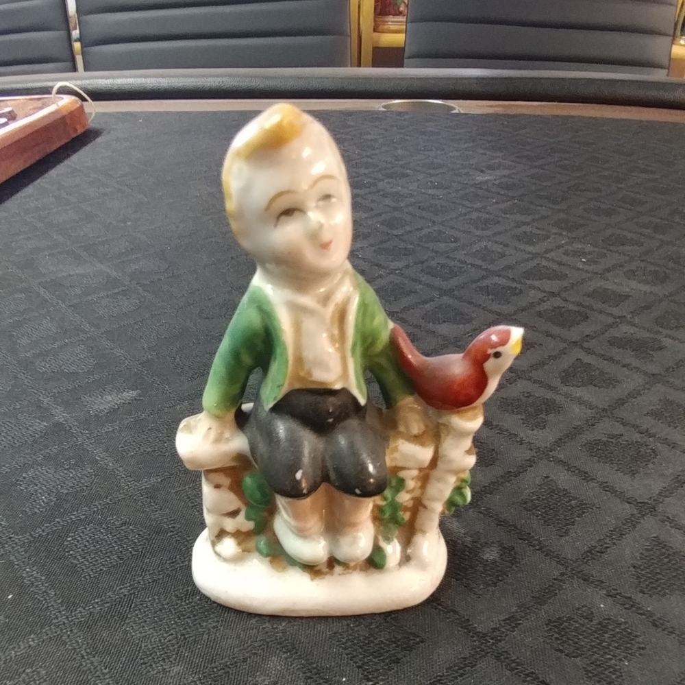 Boy sitting with Bird Figurine, Occupied Japan